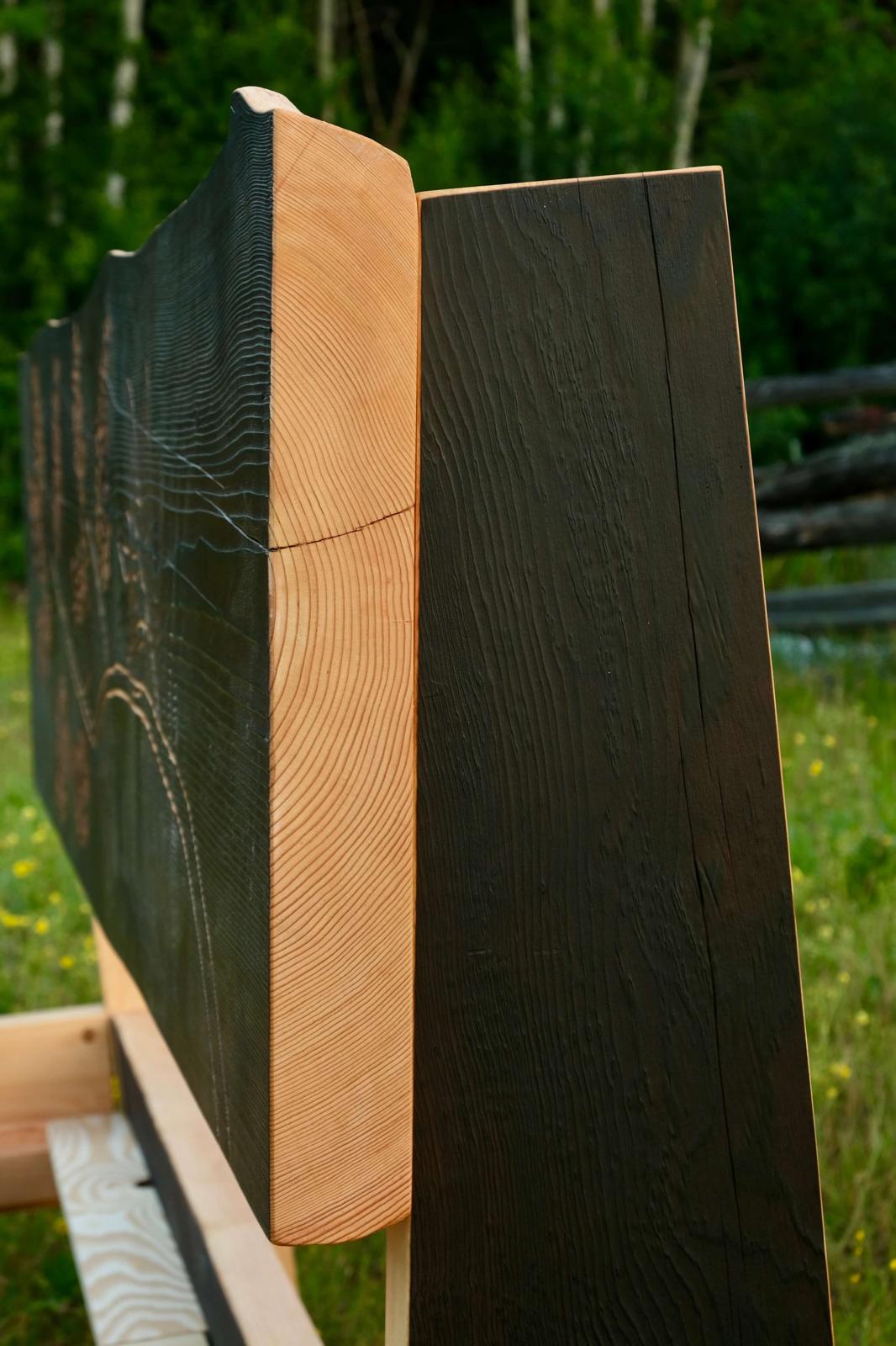 Hand-carved floral bed frame in charred solid wood, custom made in British Columbia, Canada
