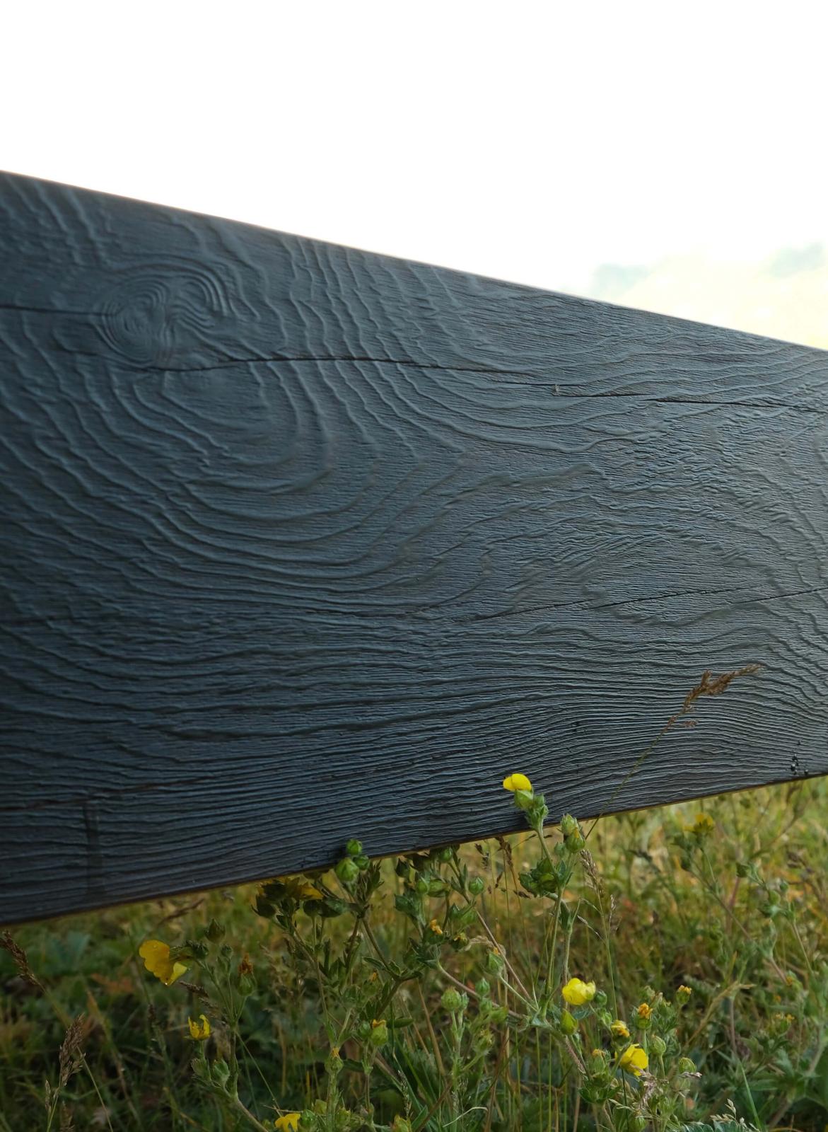 Carved footboard of the Lilac bed frame in solid Douglas fir, handmade in Tatlayoko Lake, BC